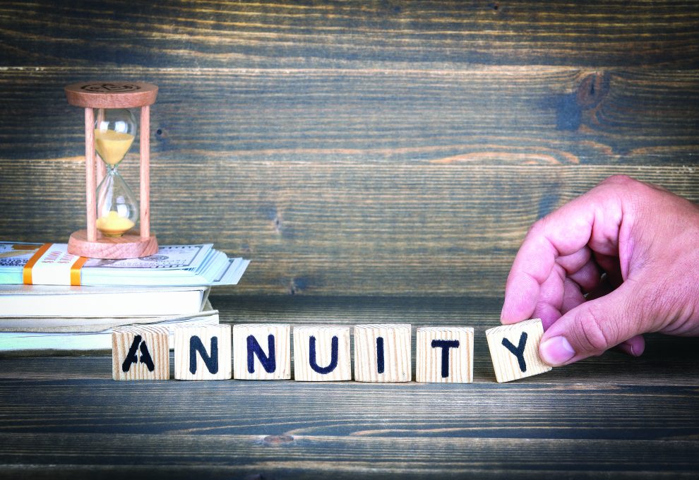 Annuity. Wooden letters on the office desk, informative and communication background